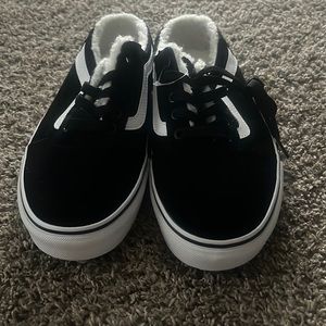 Black slip on vans with Sherpa material